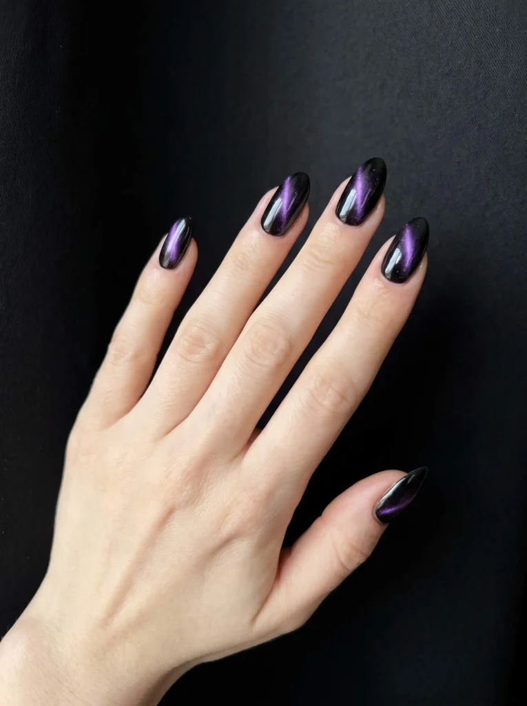 Black and purple cat eye nails