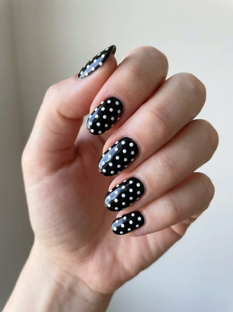Black nails with white polka dots