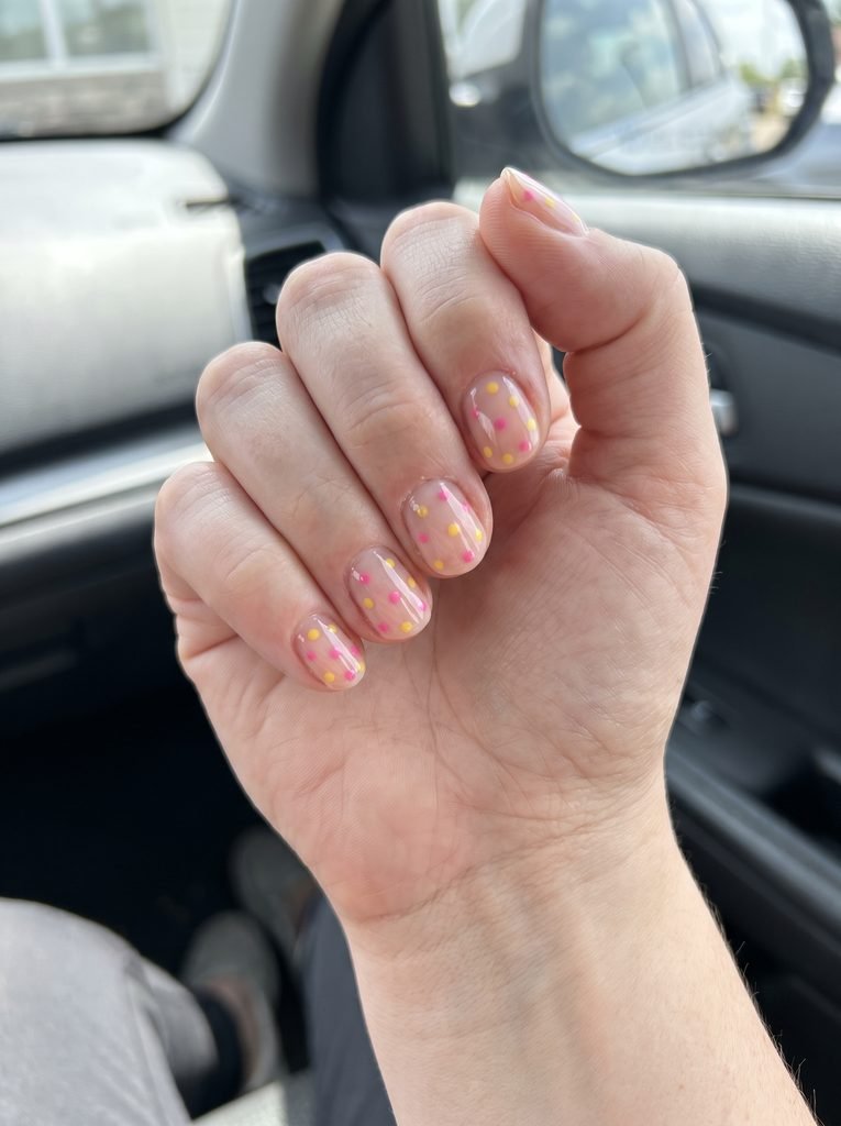 Clear base pink yellow polka dot nails