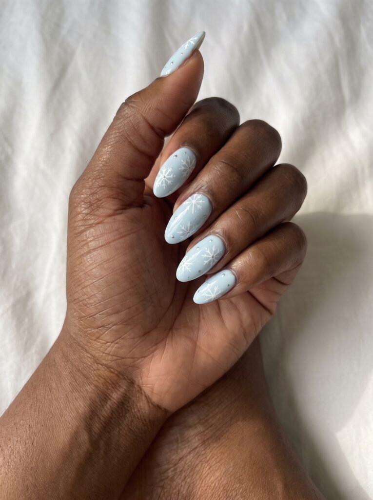 Icy Blue Snowflake Almond Nails