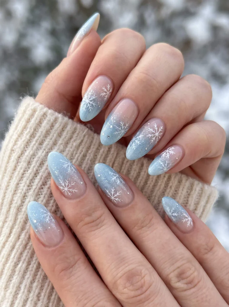 Icy Blue and White Snowflake Almond Nails