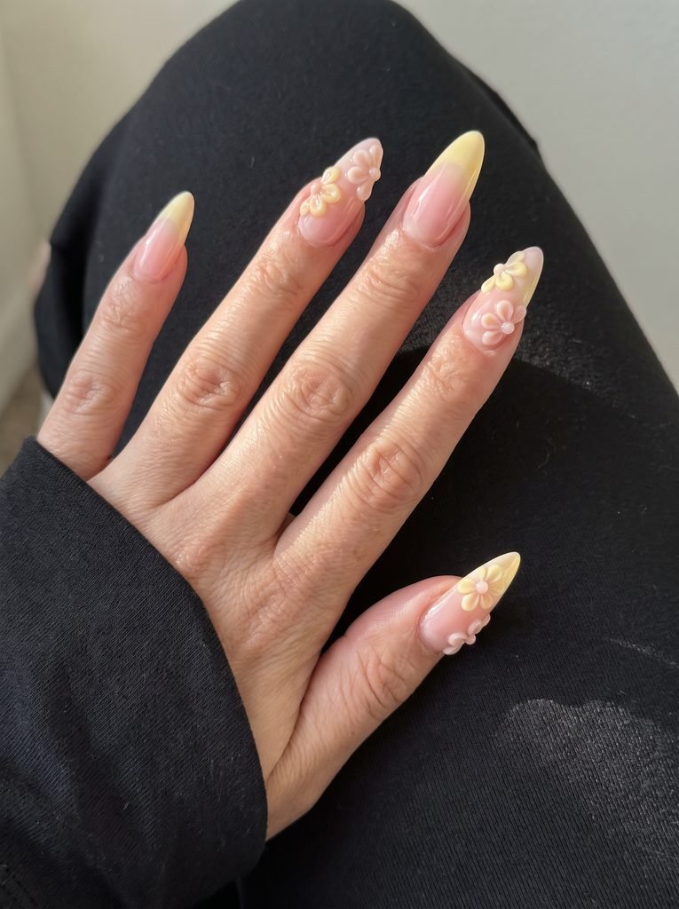 Long pink and yellow 3D nails