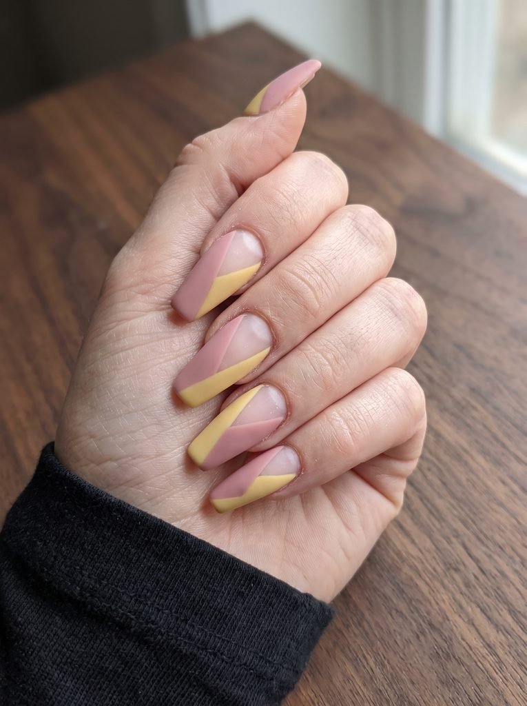 Matte pink and yellow geometric nails