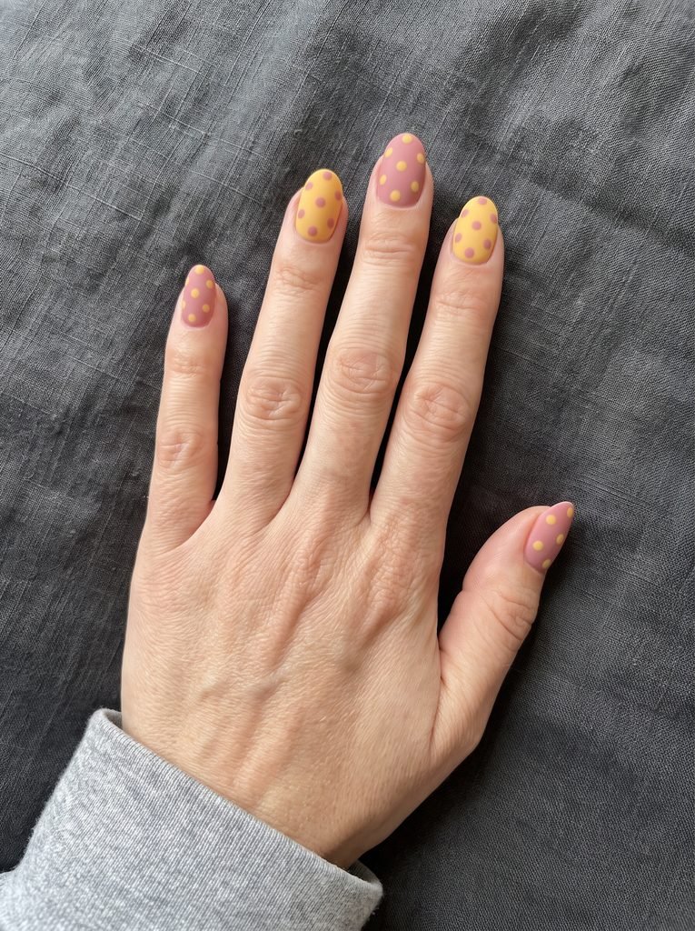 Matte pink and yellow polka dot nails