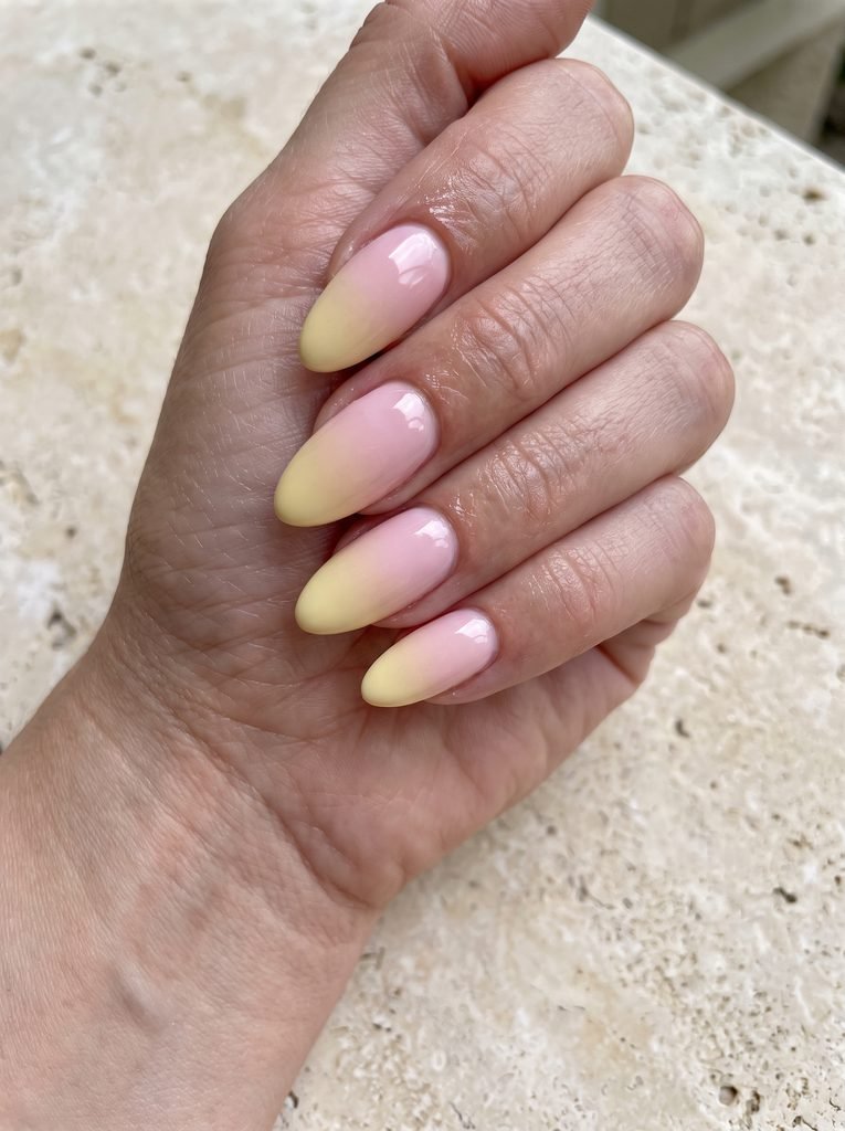 Pastel pink and yellow ombré nails