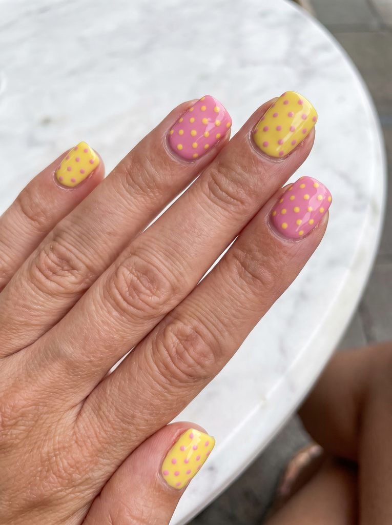 Pink and yellow polka dot nails