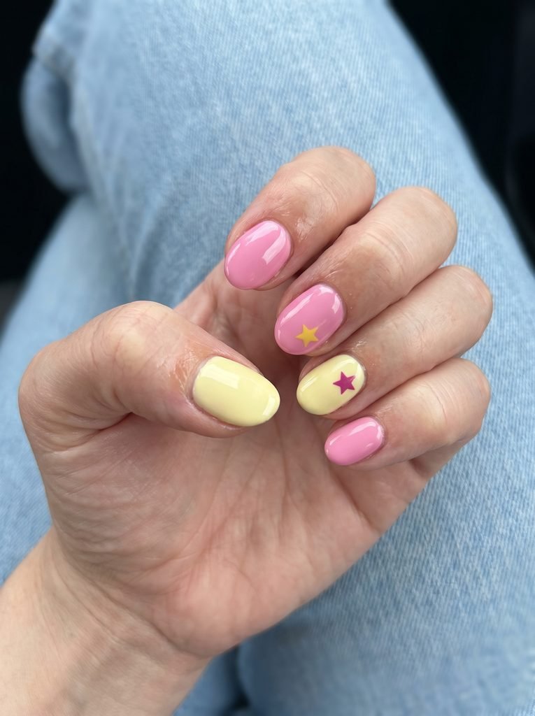 Pink and yellow star accent nails