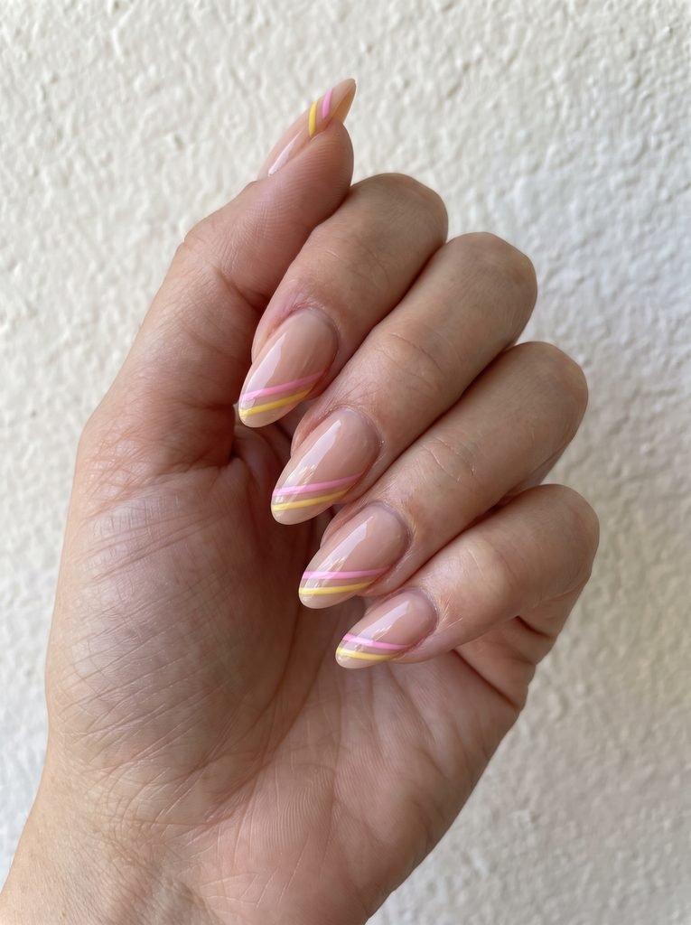 Pink and yellow striped nails
