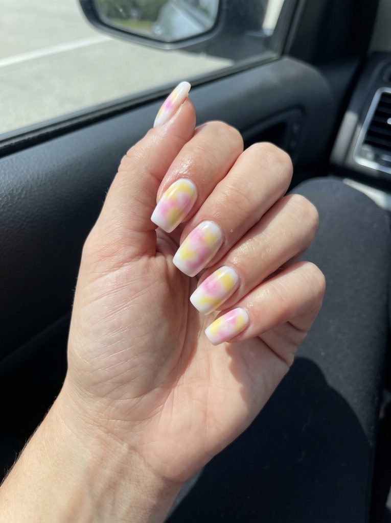 Pink and yellow tie-dye nails