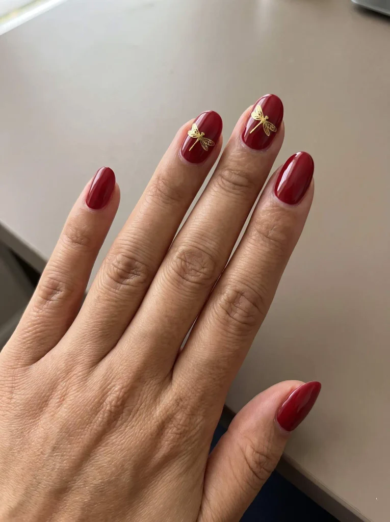 Red and gold dragonfly nails