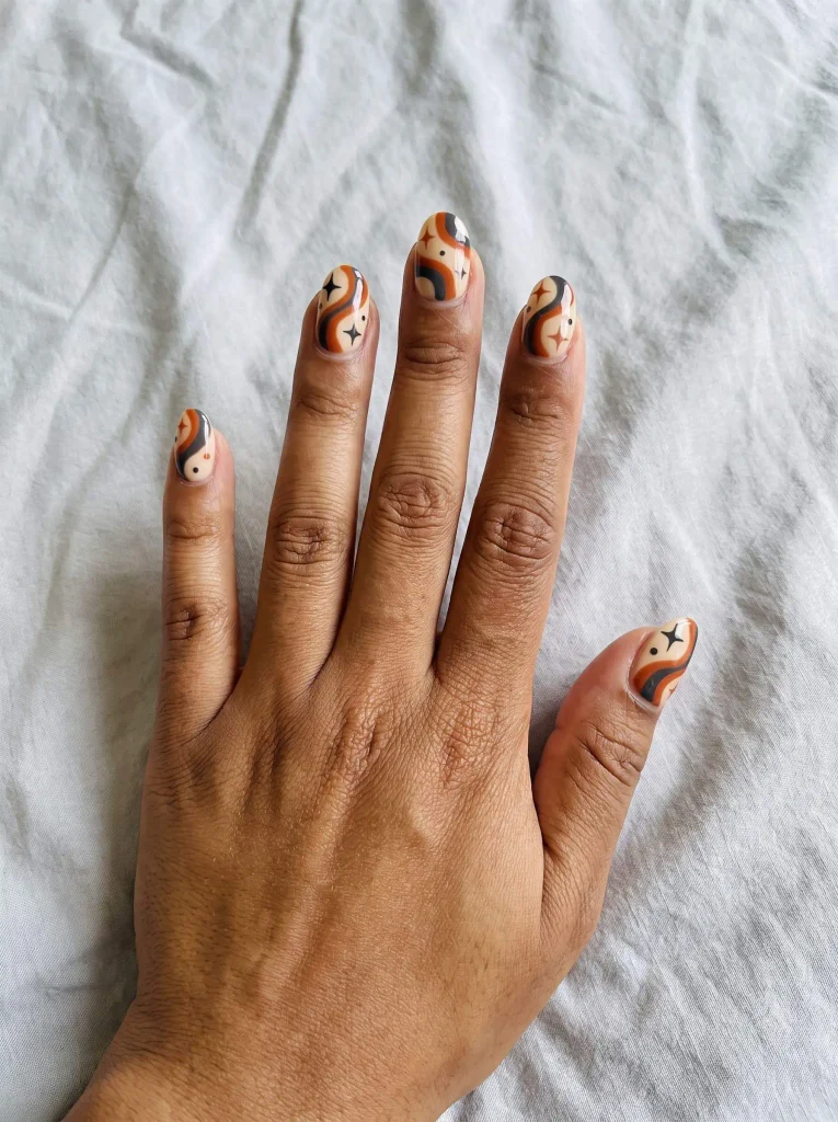 Retro Orange Halloween Nail Art with Stars