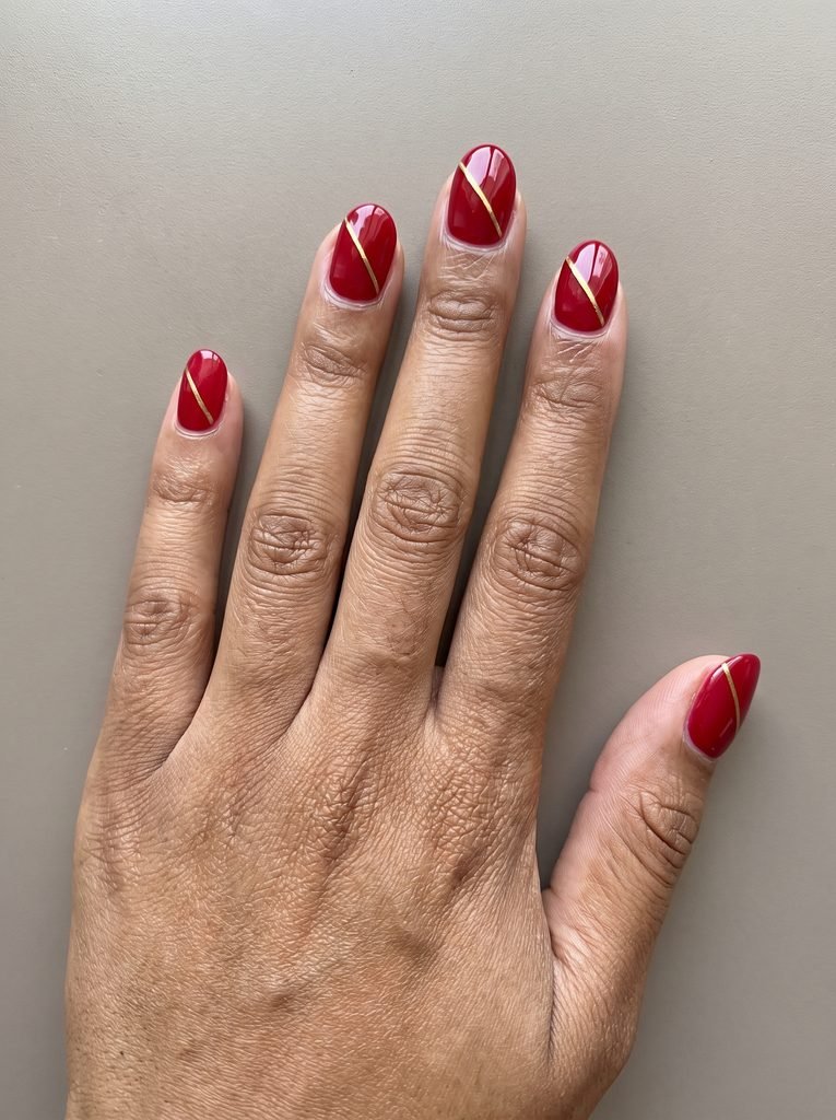 Simple Red and Gold Line Nails