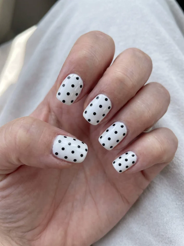 Simple white nails with black dots